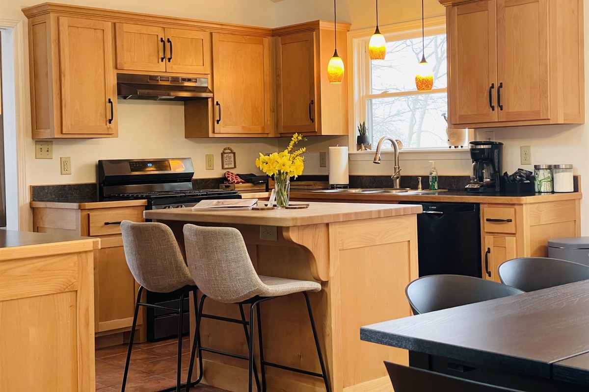 Clean, happy, fully stocked kitchen with plenty of seating 