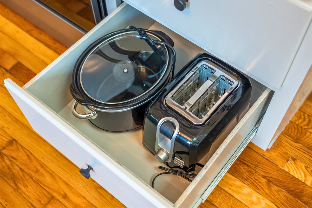 Drawers stocked with cookware and utensils make it simple to prepare meals or snacks during your stay.