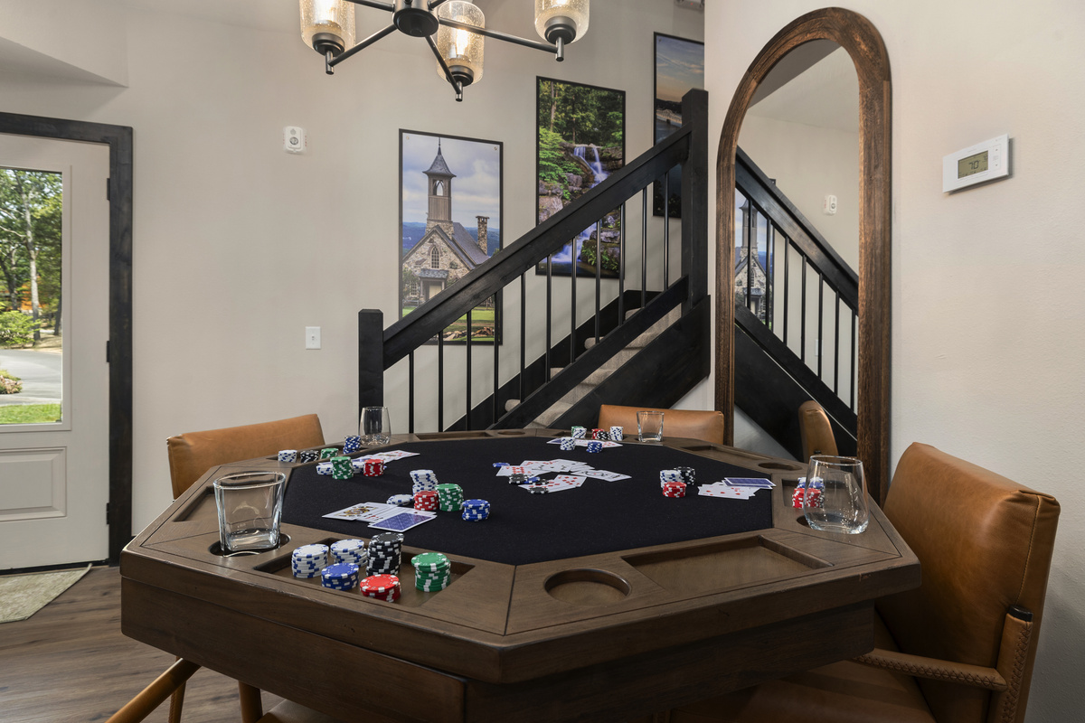 Deal a hand at the felt-top poker table tucked beneath the staircase.