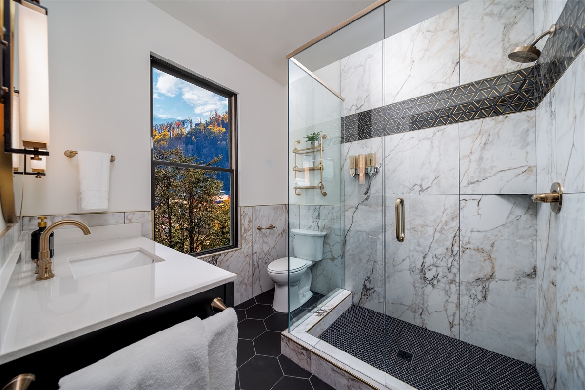 Indulge in a spa-like start to your day with a modern en-suite designed for relaxation.