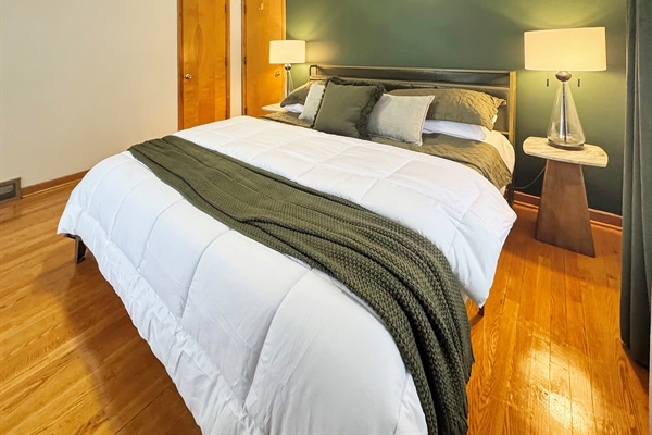 Your private retreat: freshly painted master with plush king bed.