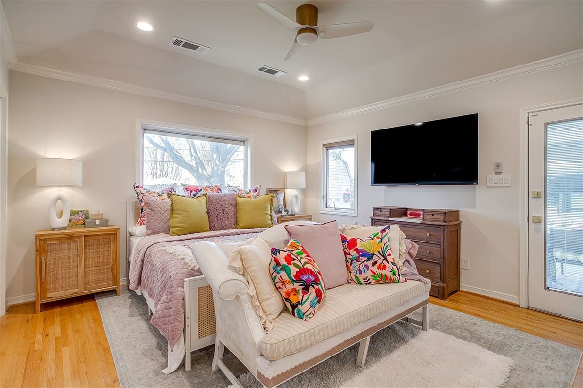 Primary suite with layered textures and natural light