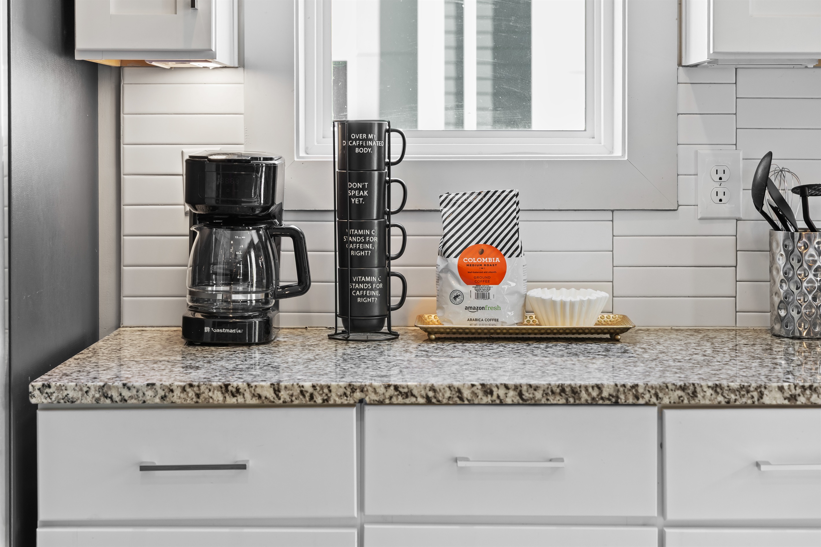 Coffee Bar: Brew your favorite coffee in style with modern appliances and charming decor!