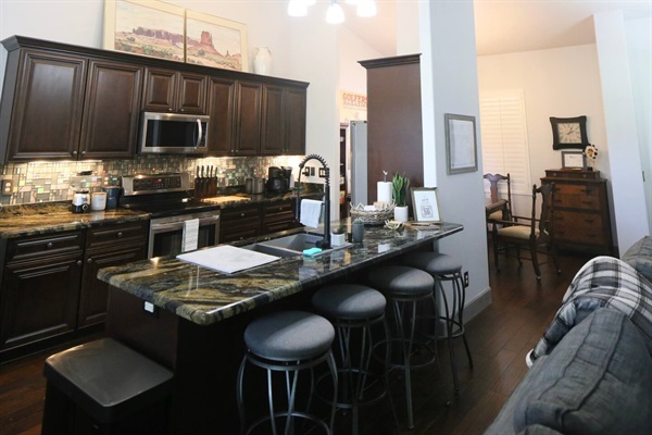 Full kitchen with eat-in bar and great room access