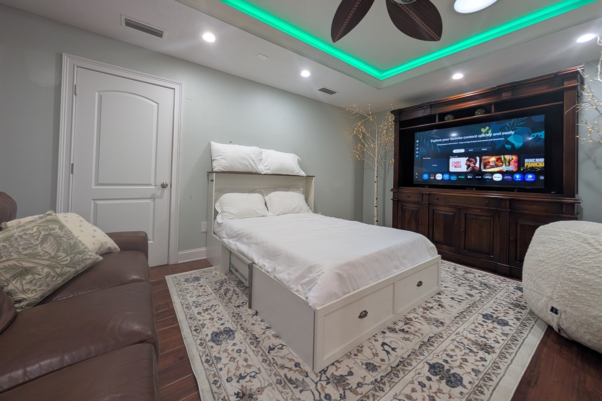 Full upstairs lounge with a pull out murphy bed