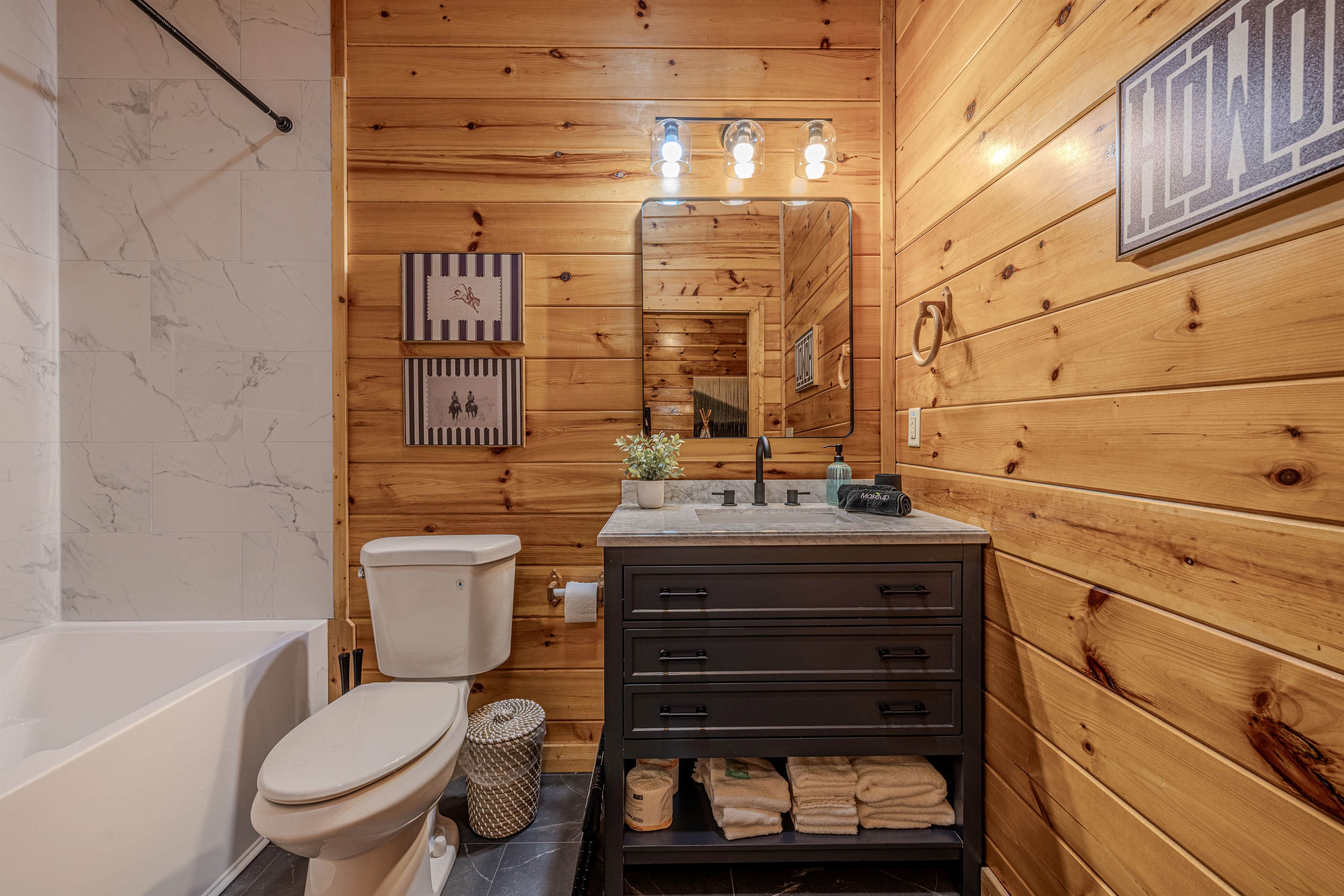 The connected bunk room has a full bath with a large tub