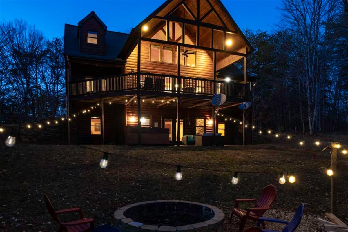 Capture the exterior beauty of the house from the cozy ambiance of the fire pit.