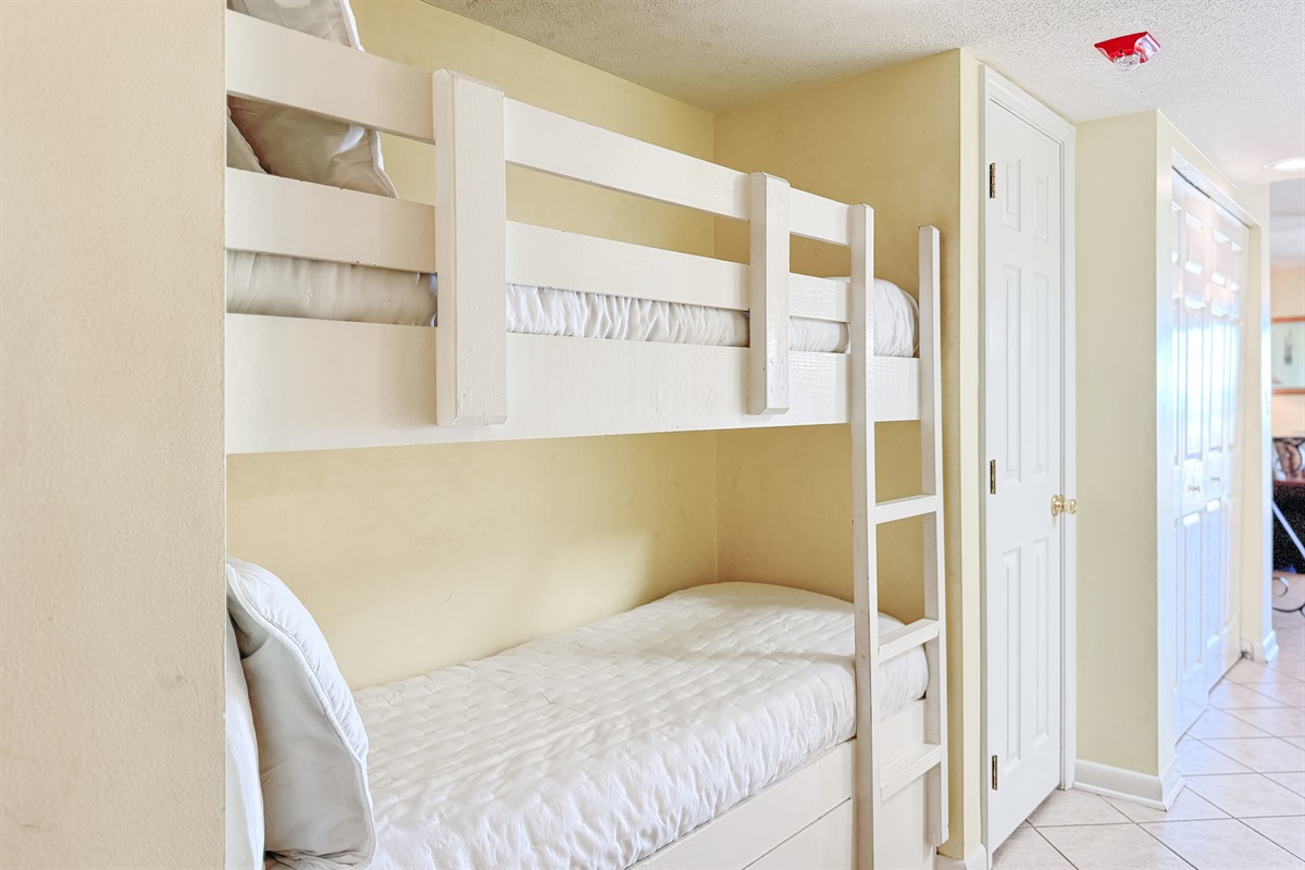 Maximize your space with these built-in bunks, offering extra sleeping arrangements without sacrificing the stunning ocean views. The ideal spot for a family beach vacation!