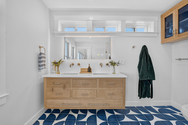 Enjoy ample counter space and a bright, modern bathroom during your stay.