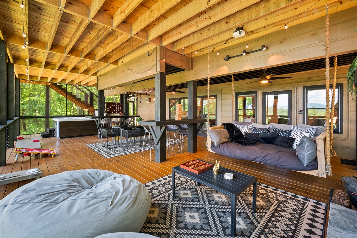 Relax around the swing bed and fireplace, immersed in forest tranquility.