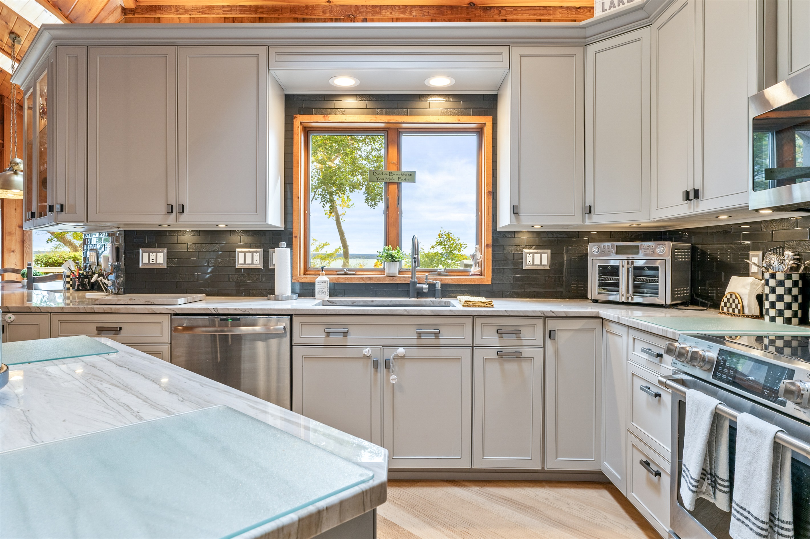 Stunning kitchen views of the lake — prepare meals surrounded by nature’s beauty and rustic elegance