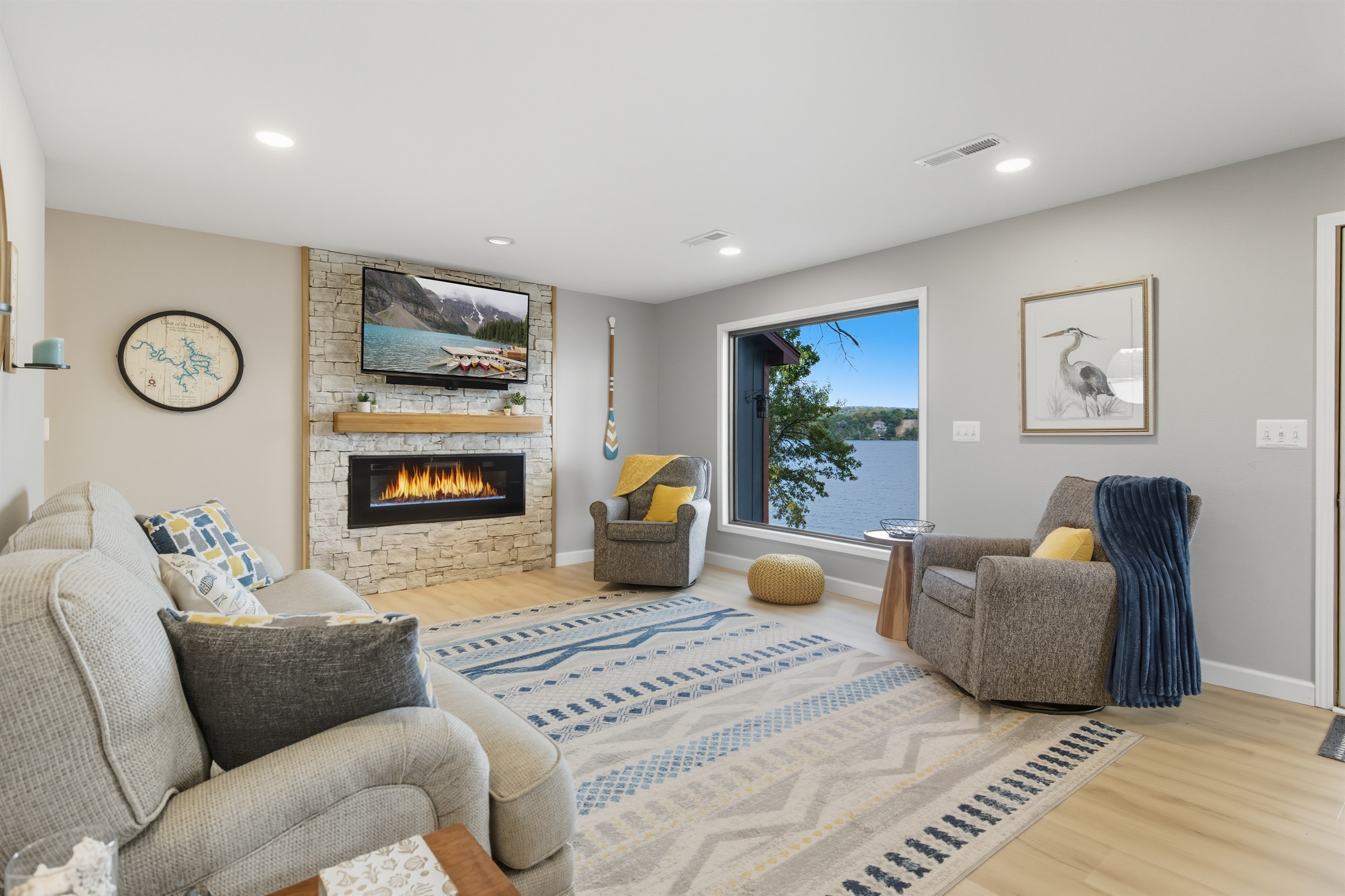 Living room with lake views and electric fireplace