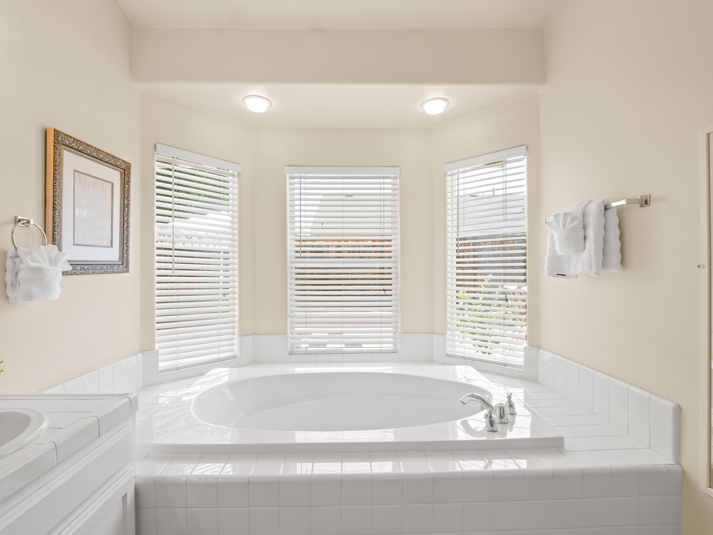 Unwind after a day of adventure in this oversized soaking tub, perfectly positioned beneath bright windows that fill the space with natural light. A peaceful spot to relax and recharge during your stay.