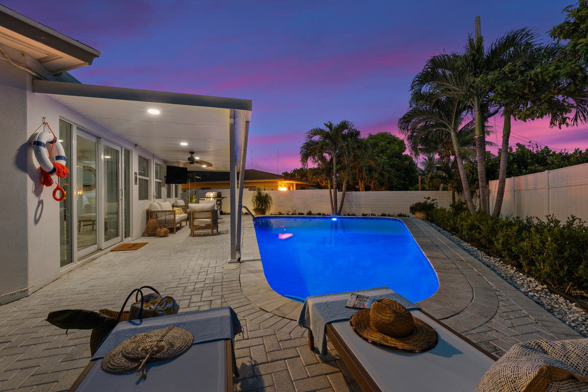 Watch the pool glow as the sun sets over your getaway