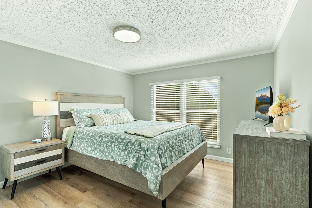 Settle into a comfortable queen bedroom with plenty of natural light, plus your own TV, dresser, and closet for an easy, comfortable stay.