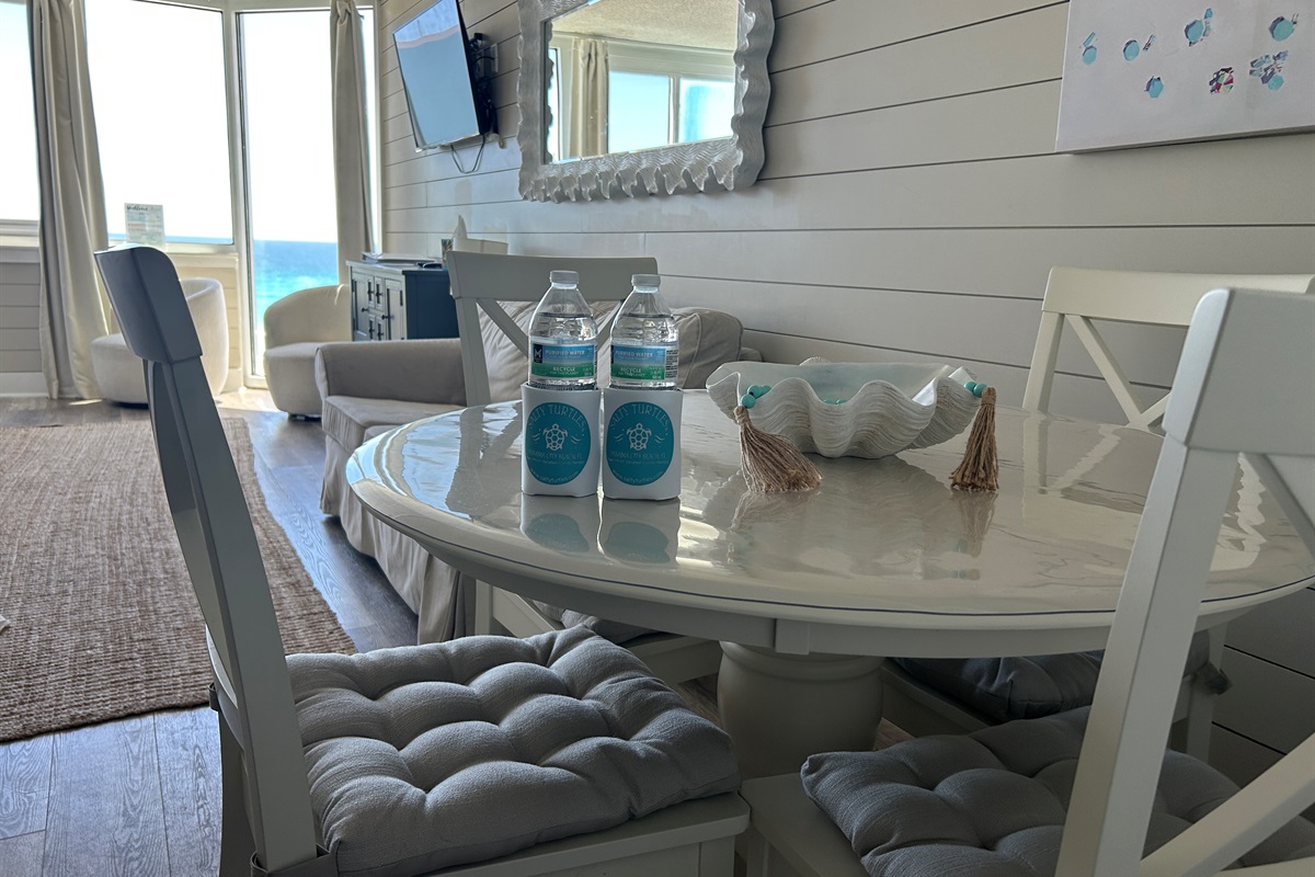 Welcome touches waiting—drinks, koozies, and a Gulf view