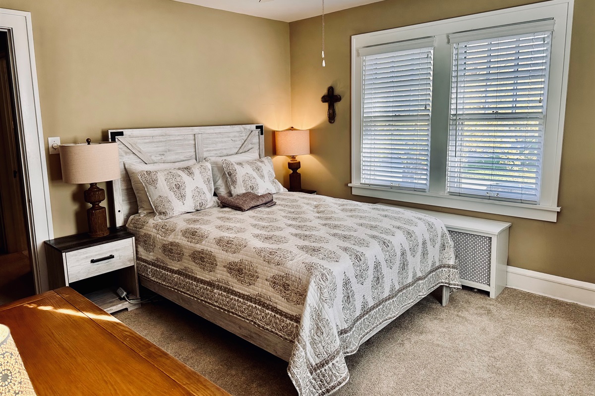Bedroom #1: Beautifully decorated primary bedroom, with a Serta mattress and low-profile box spring.