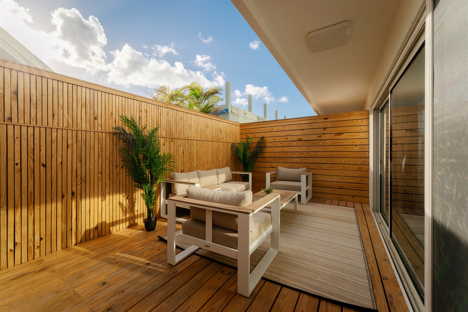 Fully fenced patio with lounge seating, perfect for morning coffee or evening cocktails