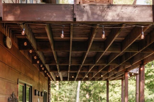 Lower level deck with seating and hot tub