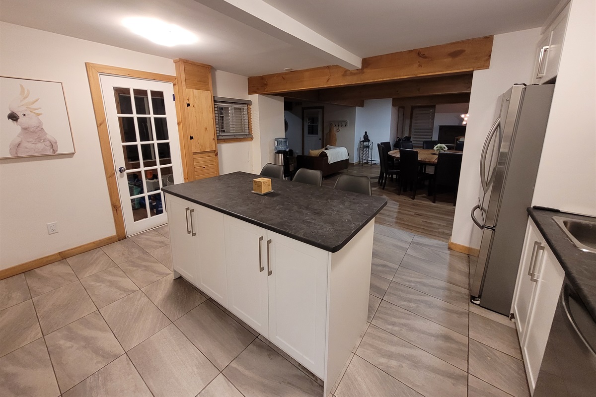 View of kitchen island and through to dining area