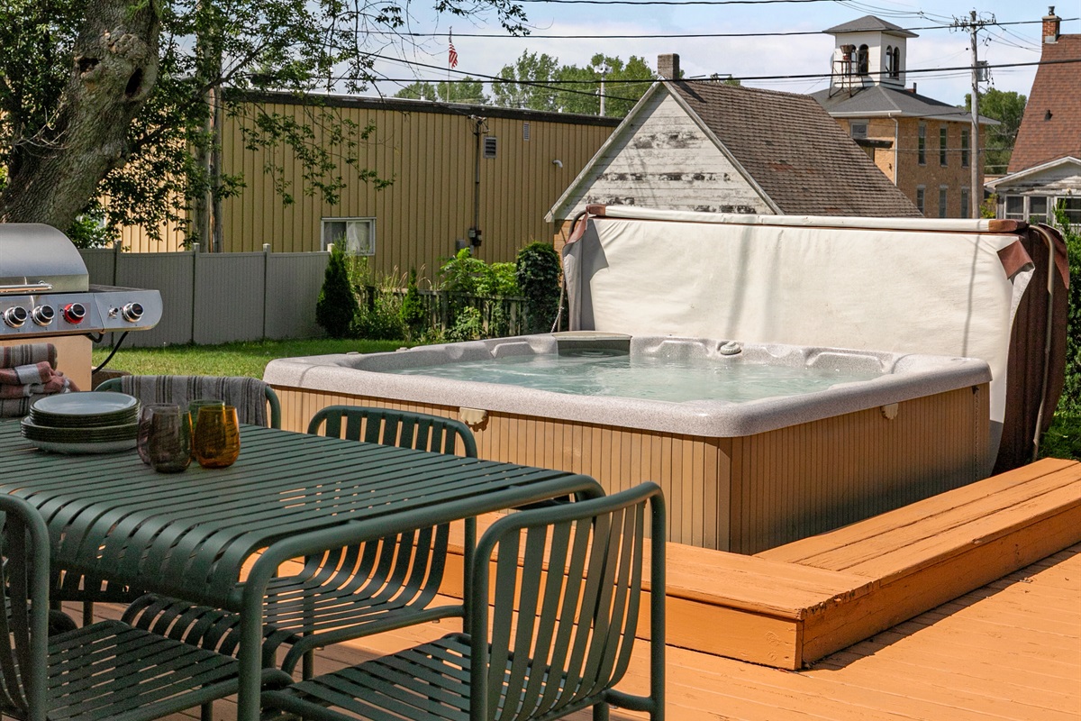 Right off the deck, the hot tub awaits — a relaxing spot to soak while enjoying the fresh air and peaceful surroundings.