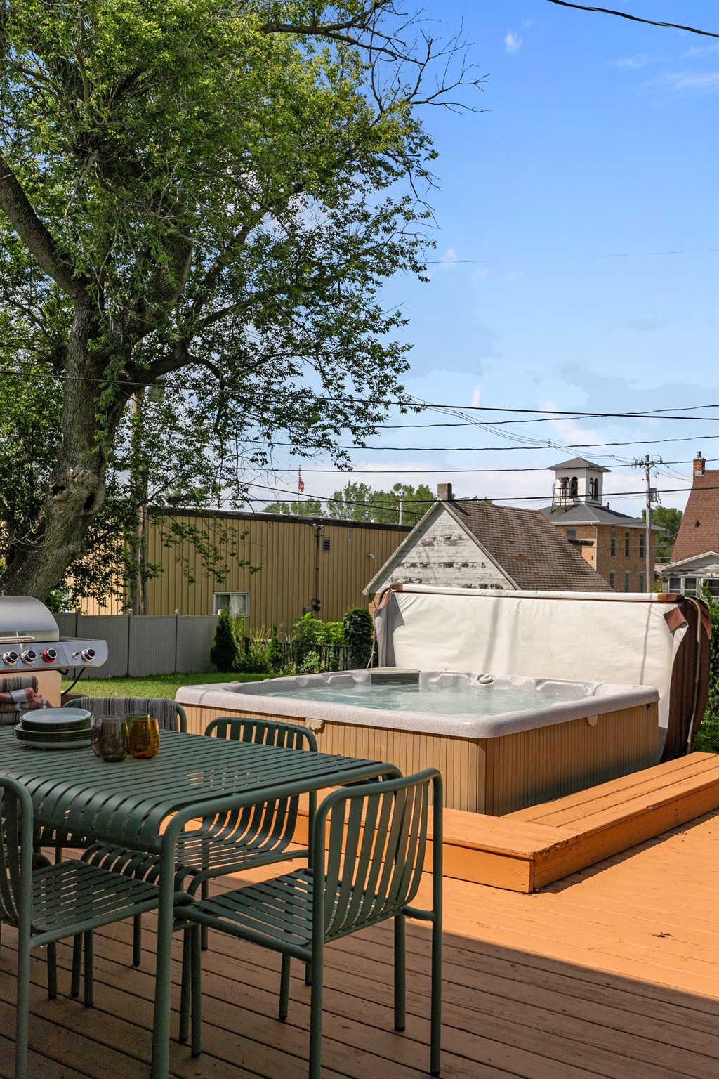 Right off the deck, the hot tub awaits — a relaxing spot to soak while enjoying the fresh air and peaceful surroundings.