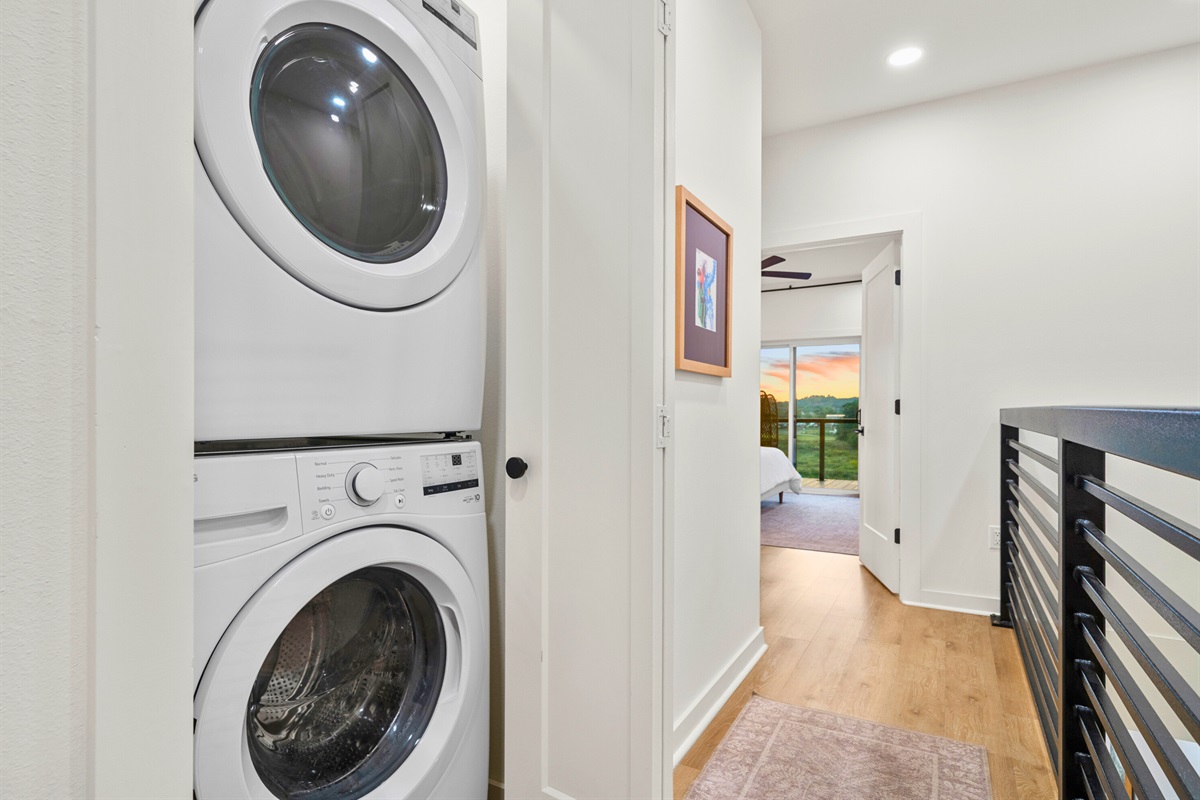 Convenient upstairs laundry with full washer/dryer and easy bedroom access.