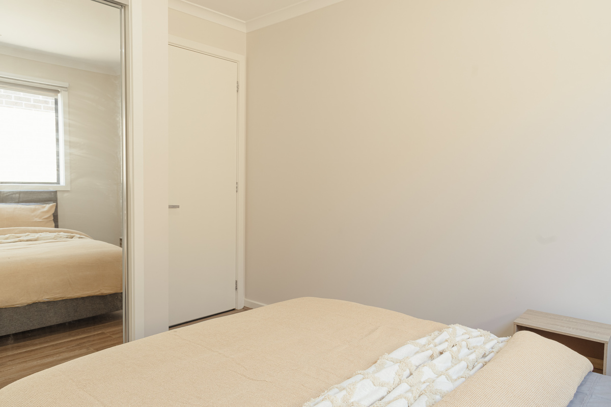 Wake to soft window light in this private bedroom, with a calm neutral setup that keeps the stay relaxed and easy.