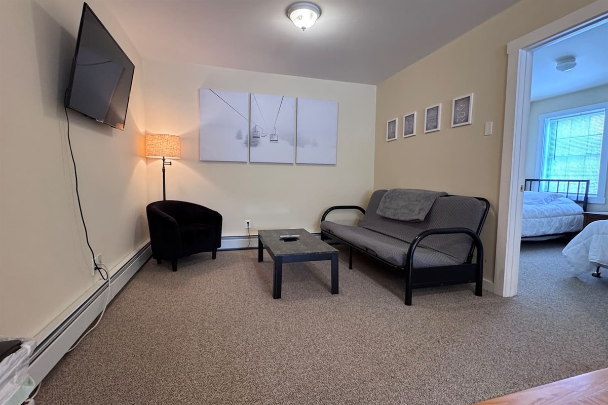 Open concept with Kitchenette, Living room, and dining area with both bedrooms and bathrooms off of the space