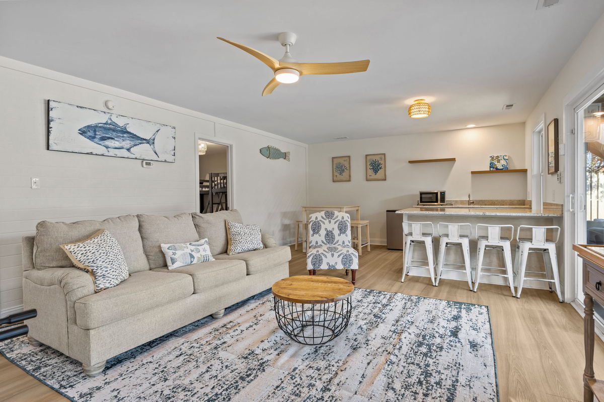 The open-concept layout creates the perfect space for movie nights, game days, or spending quality time together
