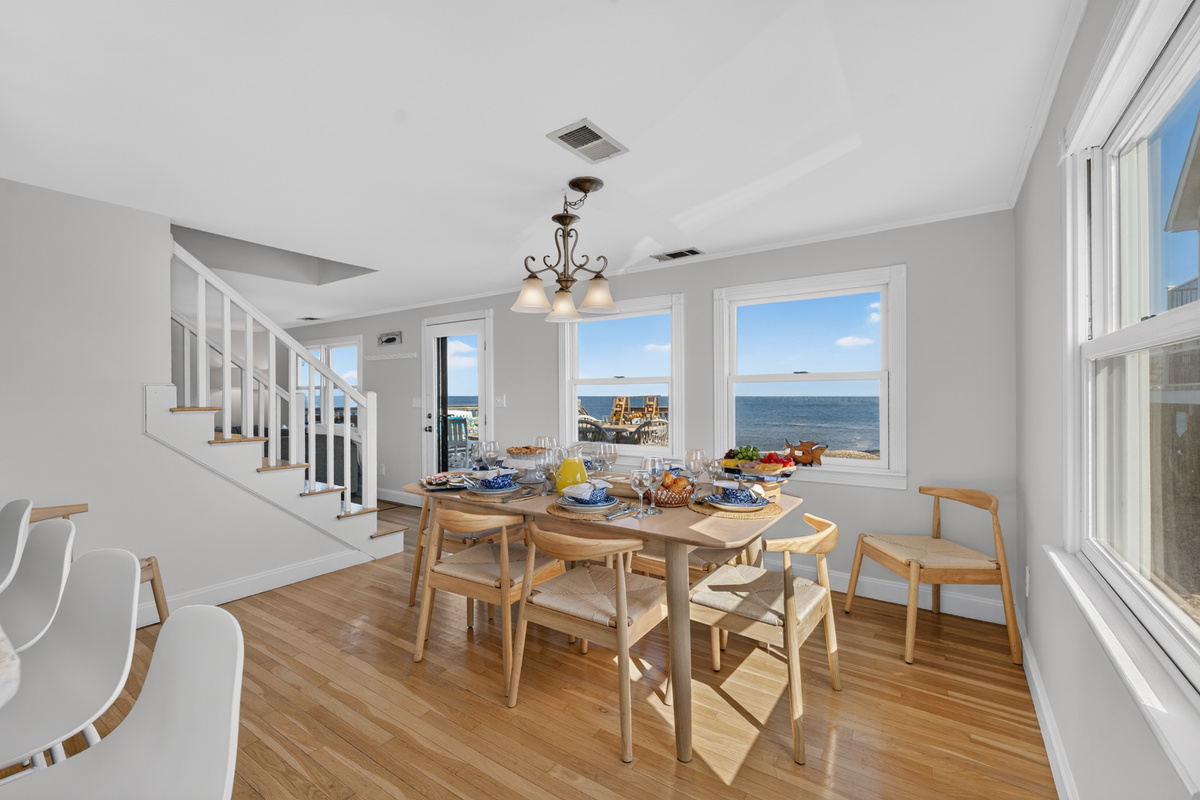 Gather around the dining table while enjoying beautiful ocean views just beyond the windows.
