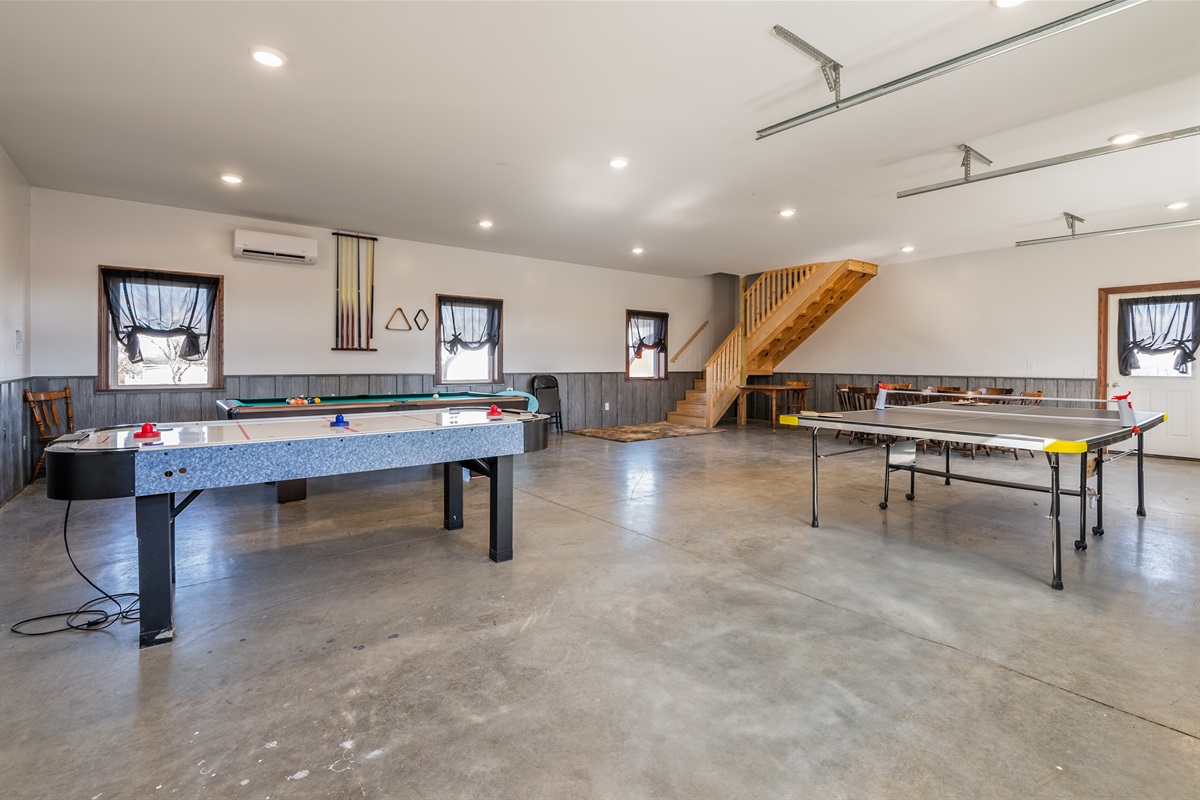 Spacious game room with ping-pong and pool tables—perfect for friendly competitions and fun nights in!