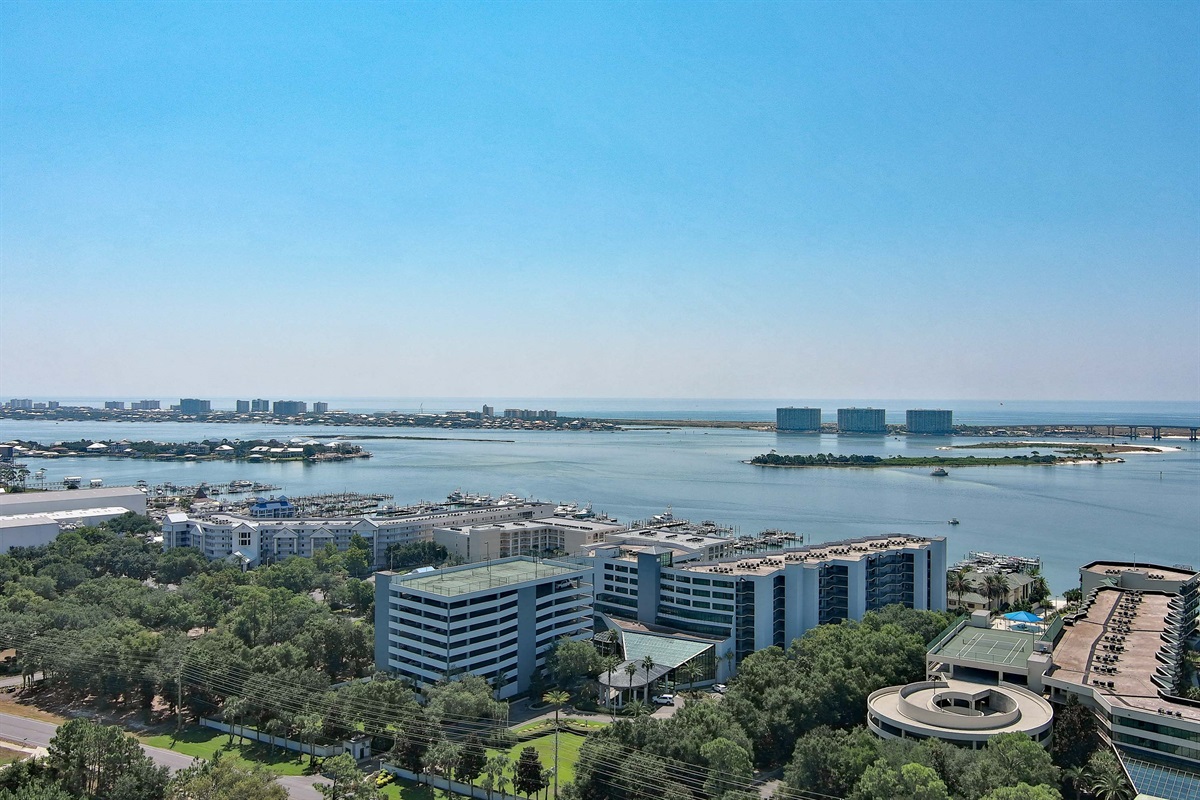 The bay, the bridge, and beyond. Your stunning coastal escape awaits with this incredible aerial view.