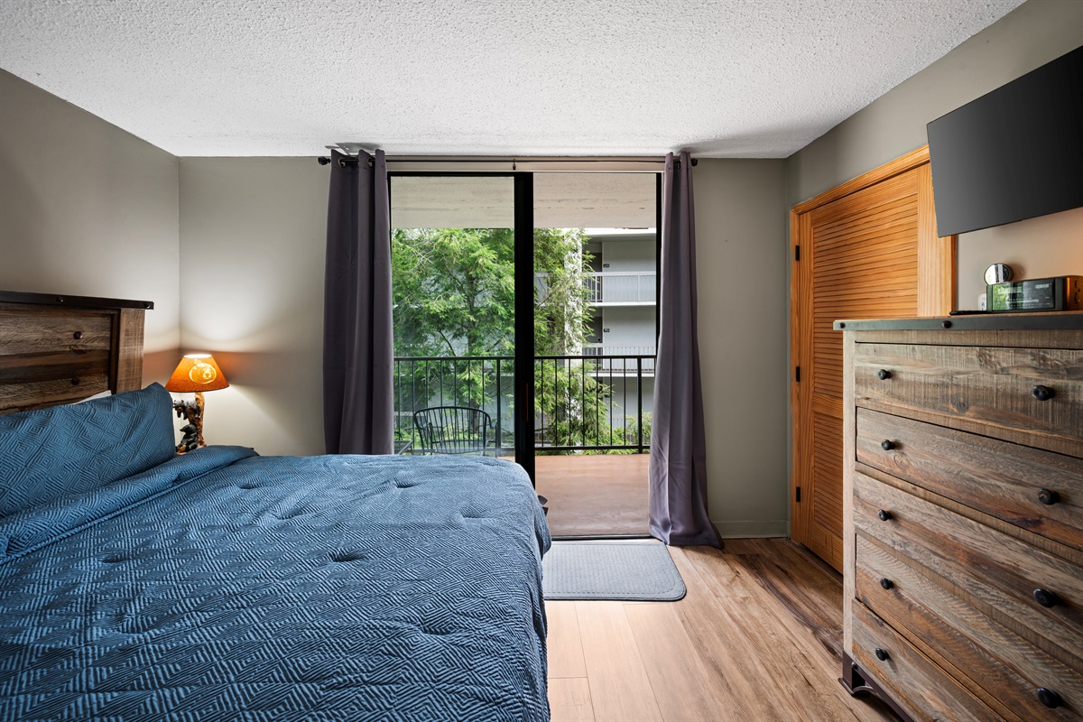 Bright and inviting bedroom with flat-screen TV