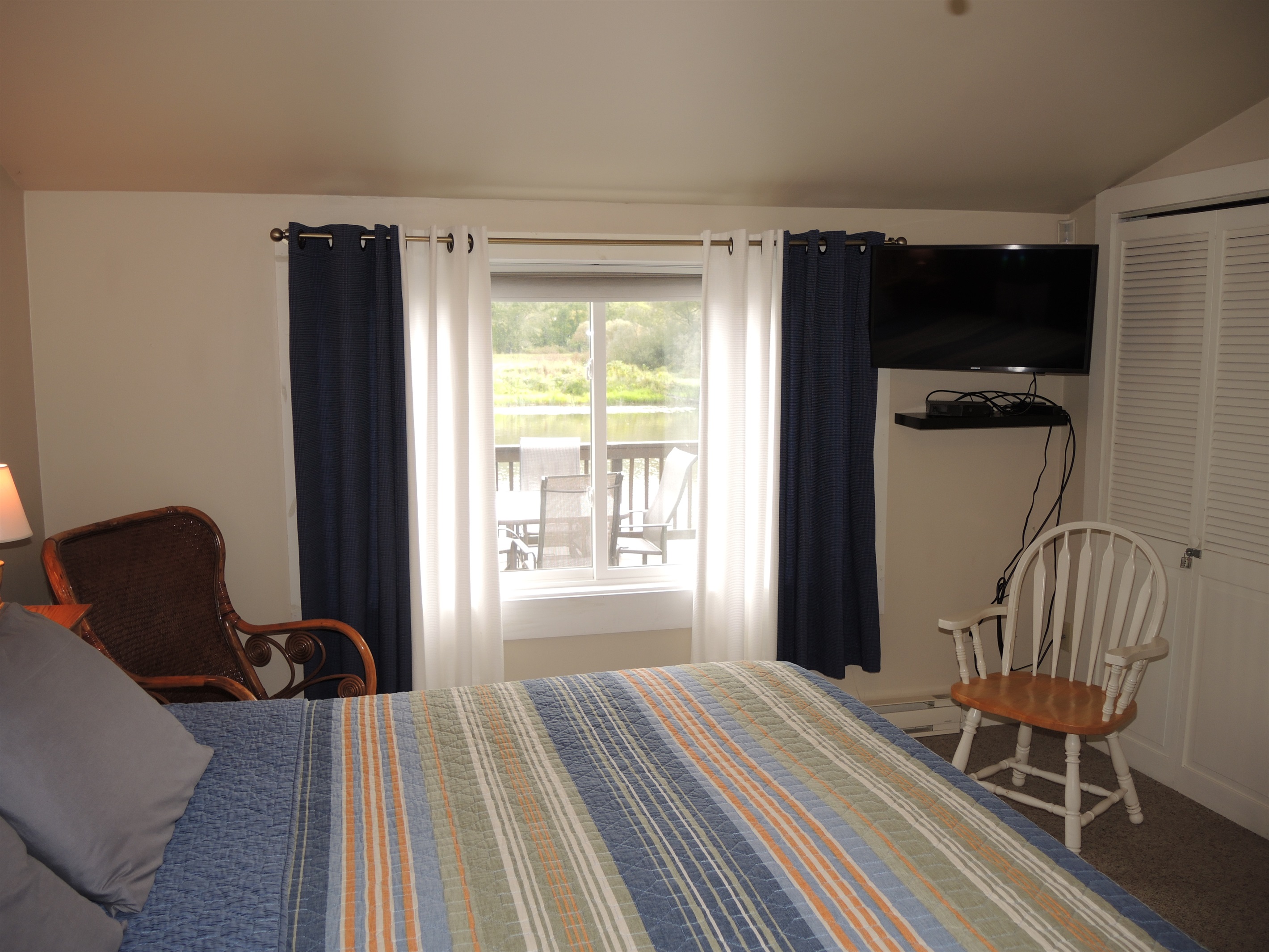 King bedroom with view of water