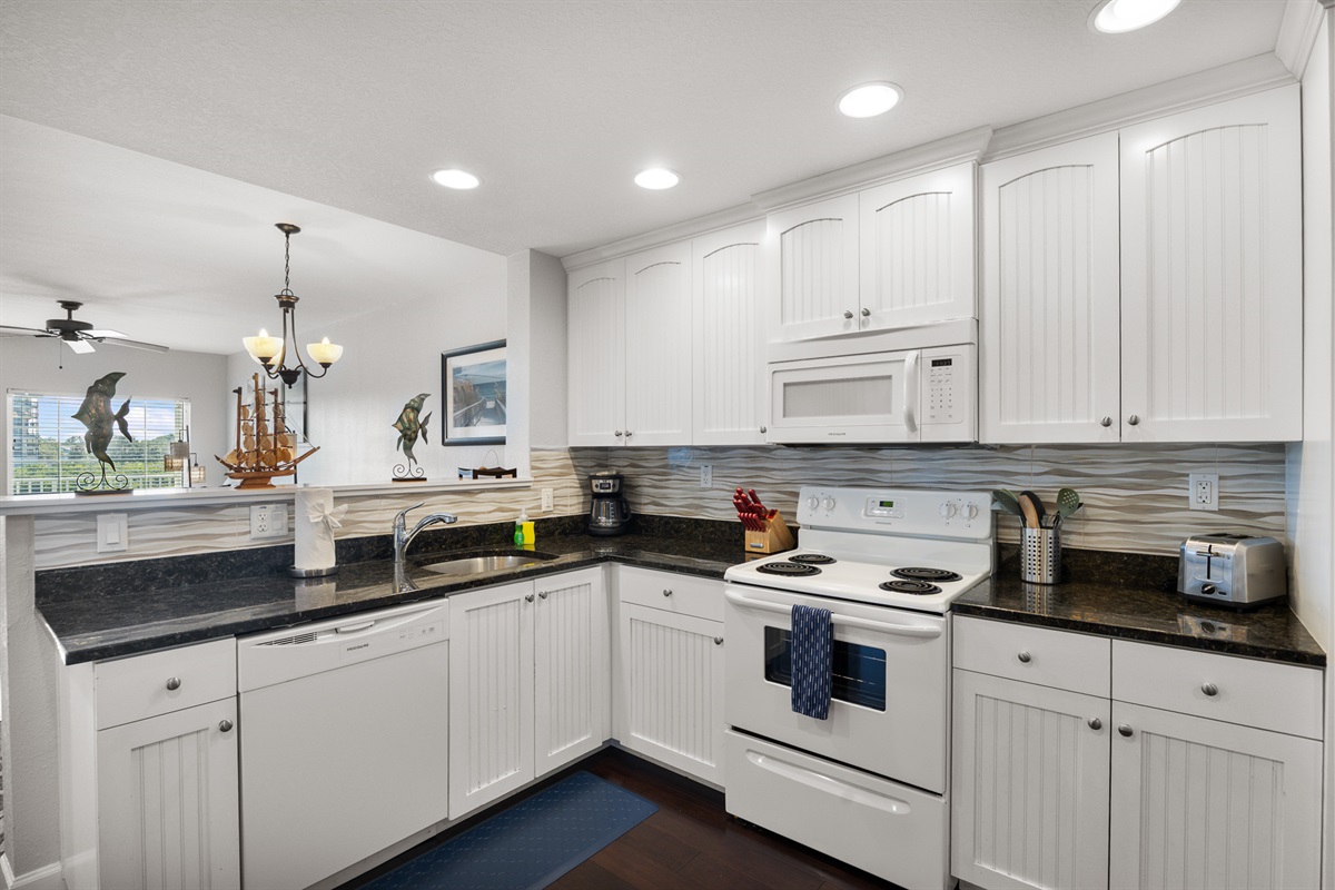 Kitchen, fully stocked with cooking/eating/drinking utensils