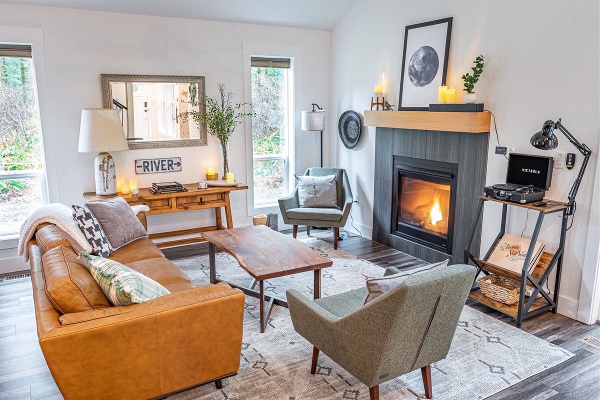 Living room w/ Leather Sofa, Article Chairs, Propane Fire Place, Record Player and Bose Soundbar