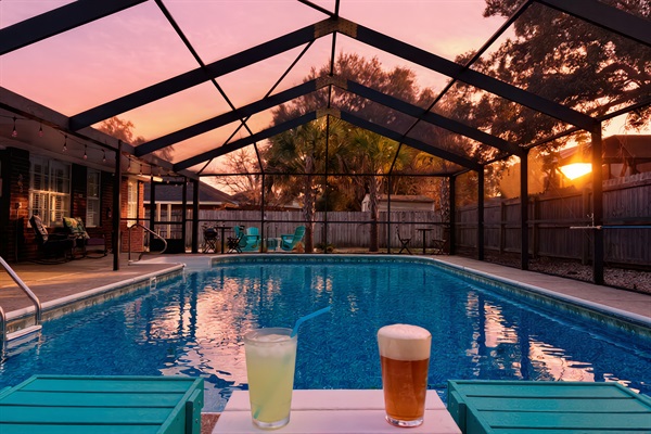 Relax and soak up the sunset with a cold beverage in Polywood chaise lounges next to the gorgeous, screened-in and the heated (year-round) pool. Cheers!