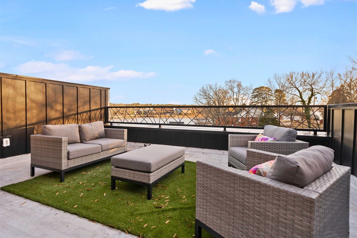 A cozy outdoor seating area with comfortable furniture and breathtaking views creates the perfect spot for relaxation or conversation.