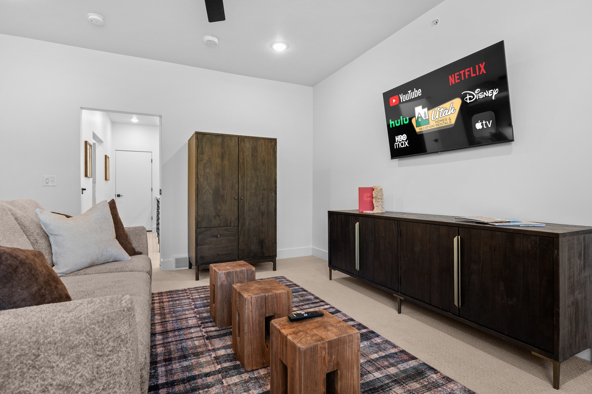 Second living area with Smart TV and comfortable seating.