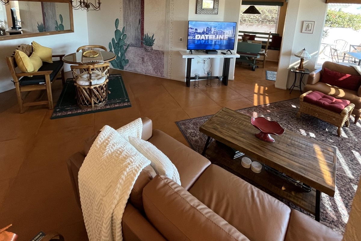 Living room Smart TV is 50 inches and offers basic cable channels and HD streaming options