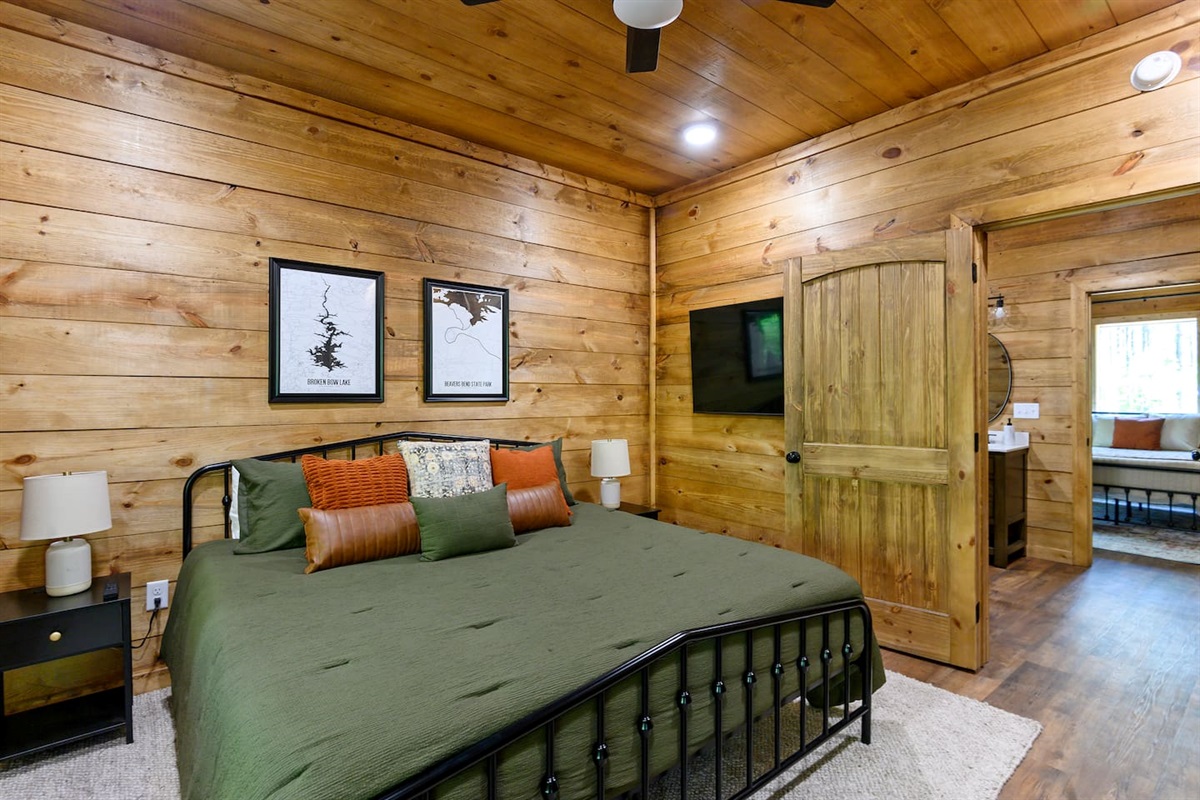 Soft linens, blackout shades, and rustic charm invite deep sleep and lazy mornings.