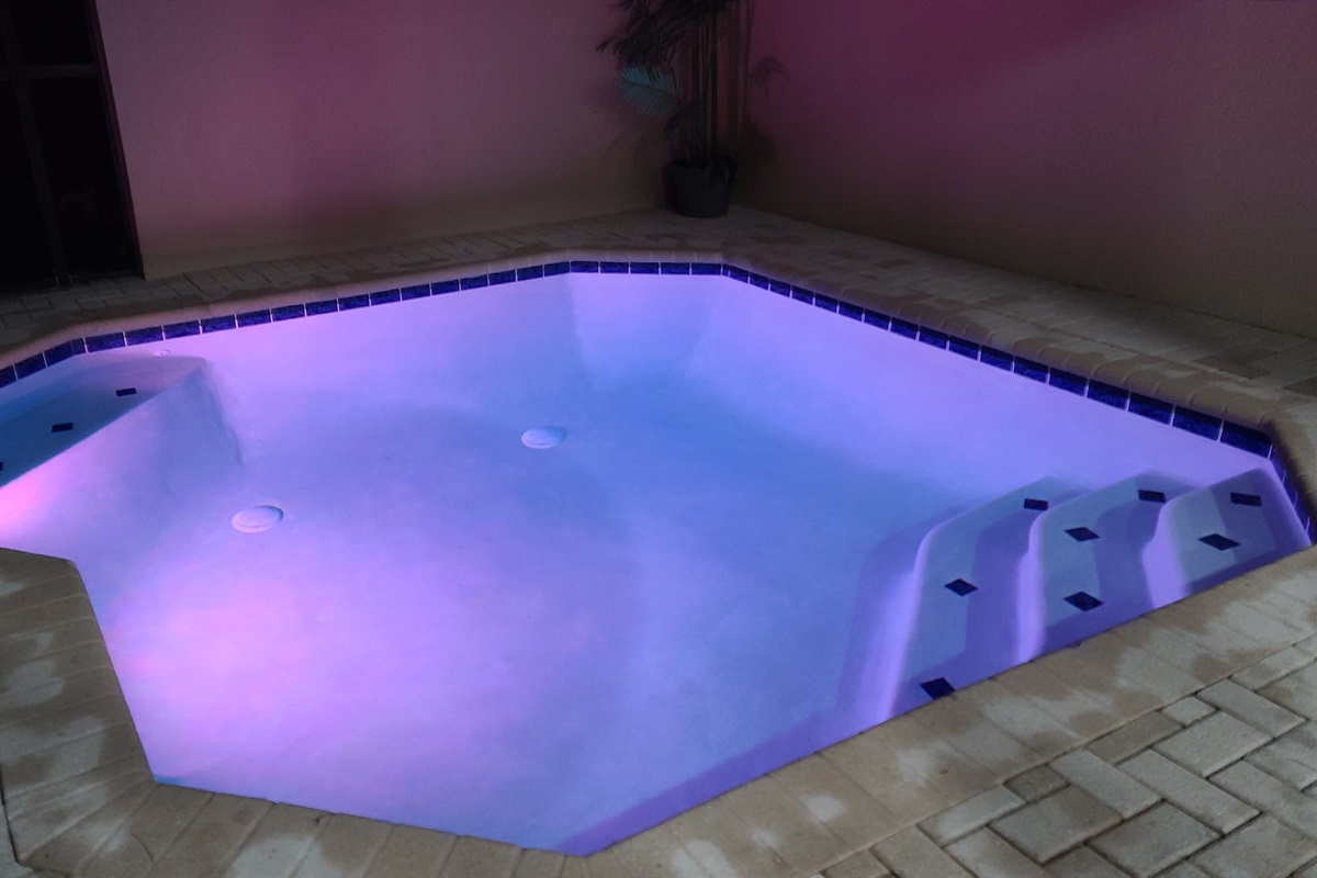 Twilight photo of Belle’s Villa pool with no rear neighbors and quiet views
