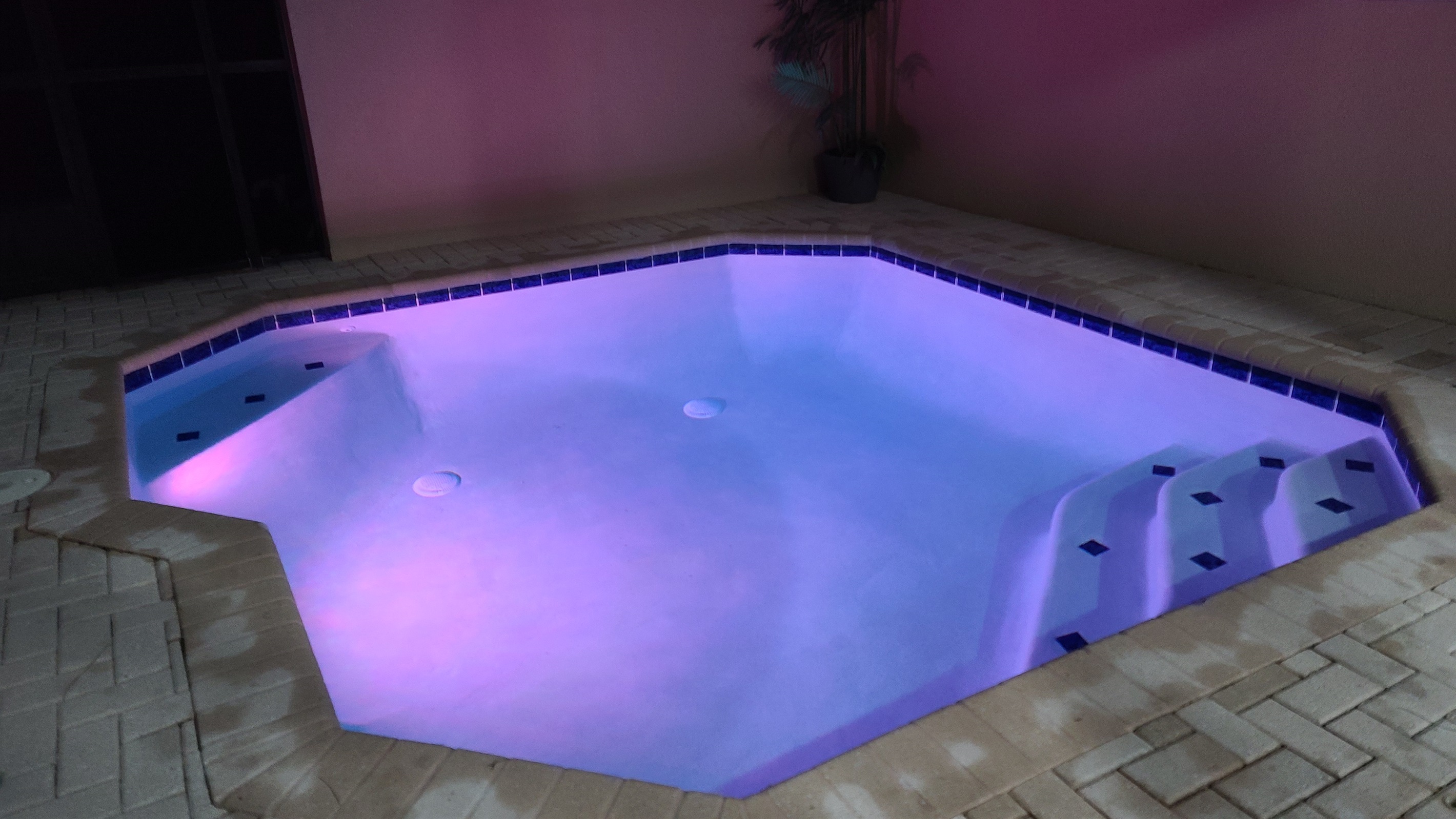 Twilight photo of Belle’s Villa pool with no rear neighbors and quiet views