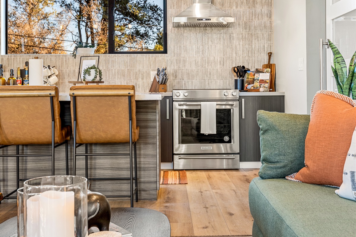 The living area flows easily into the kitchen, creating a relaxed space for cooking, conversation, and time together.