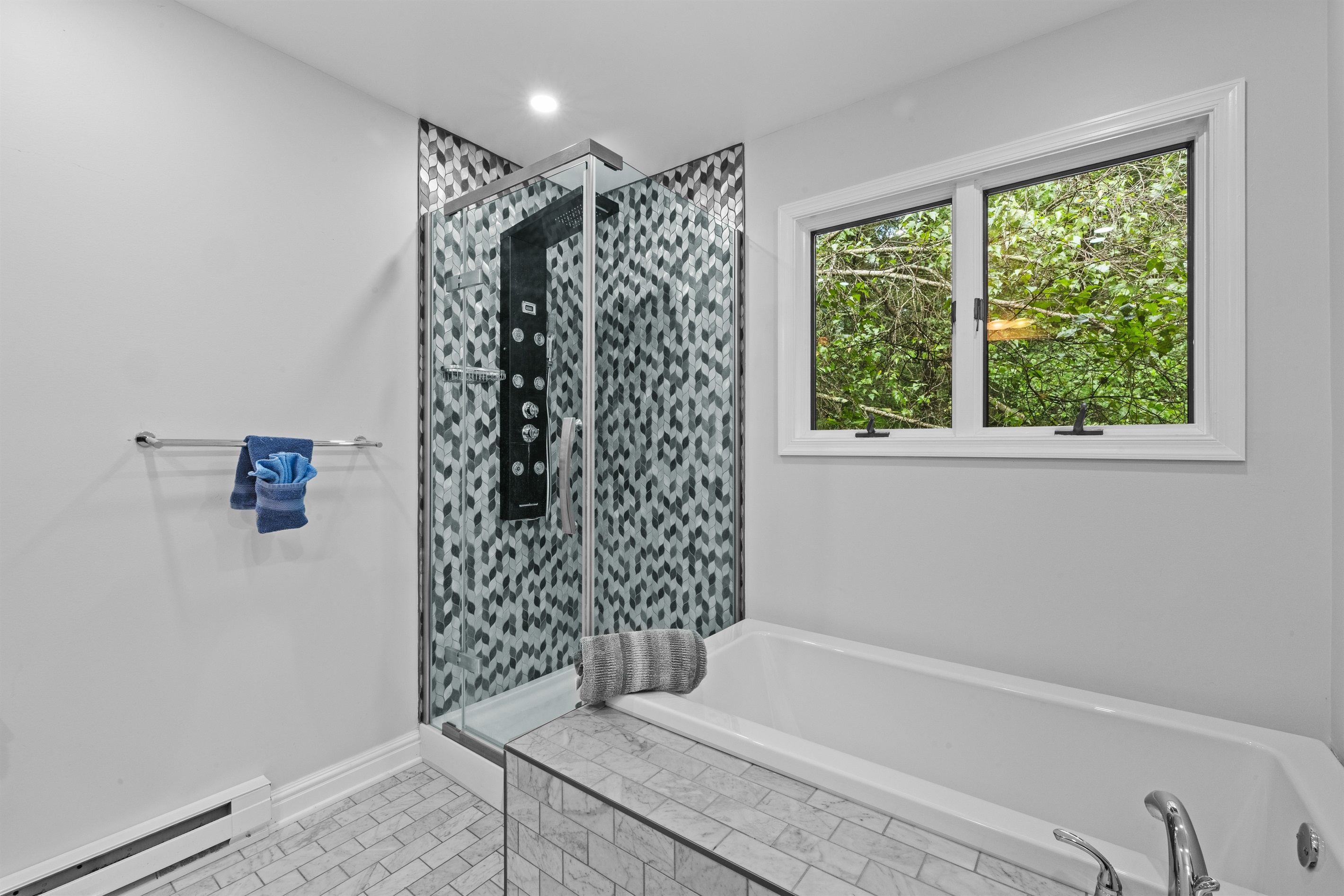 Spacious full bathroom featuring both a walk-in shower and soaking tub