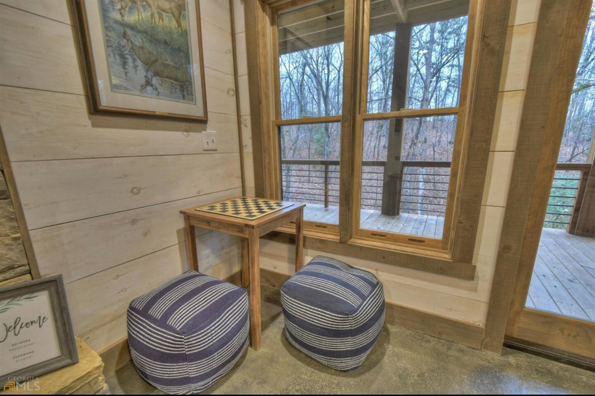 Basement game room has two game tables.  This one has checkers and chess.  The other is suited for board games or cards.