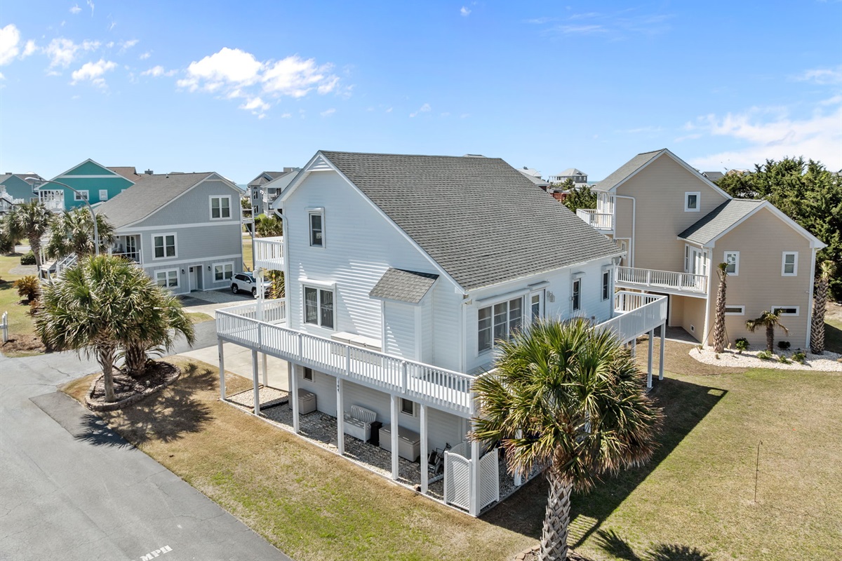 Your corner lot beach home with wraparound deck and plenty of outdoor space