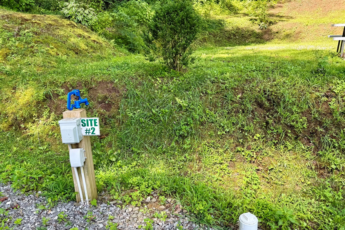 Site 2 — Full hookups and full charm, with a fire ring for perfect evenings