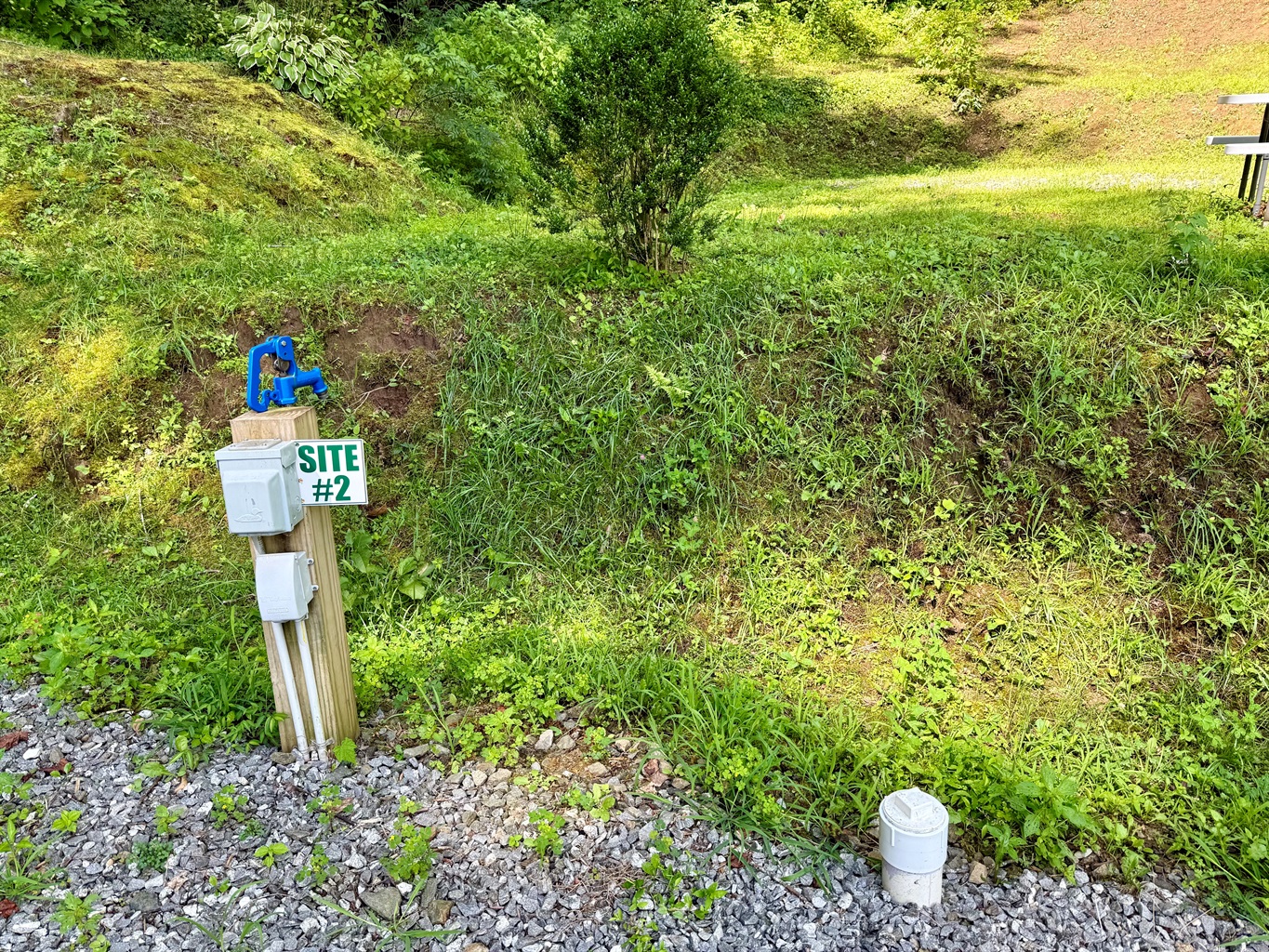 Site 2 — Full hookups and full charm, with a fire ring for perfect evenings